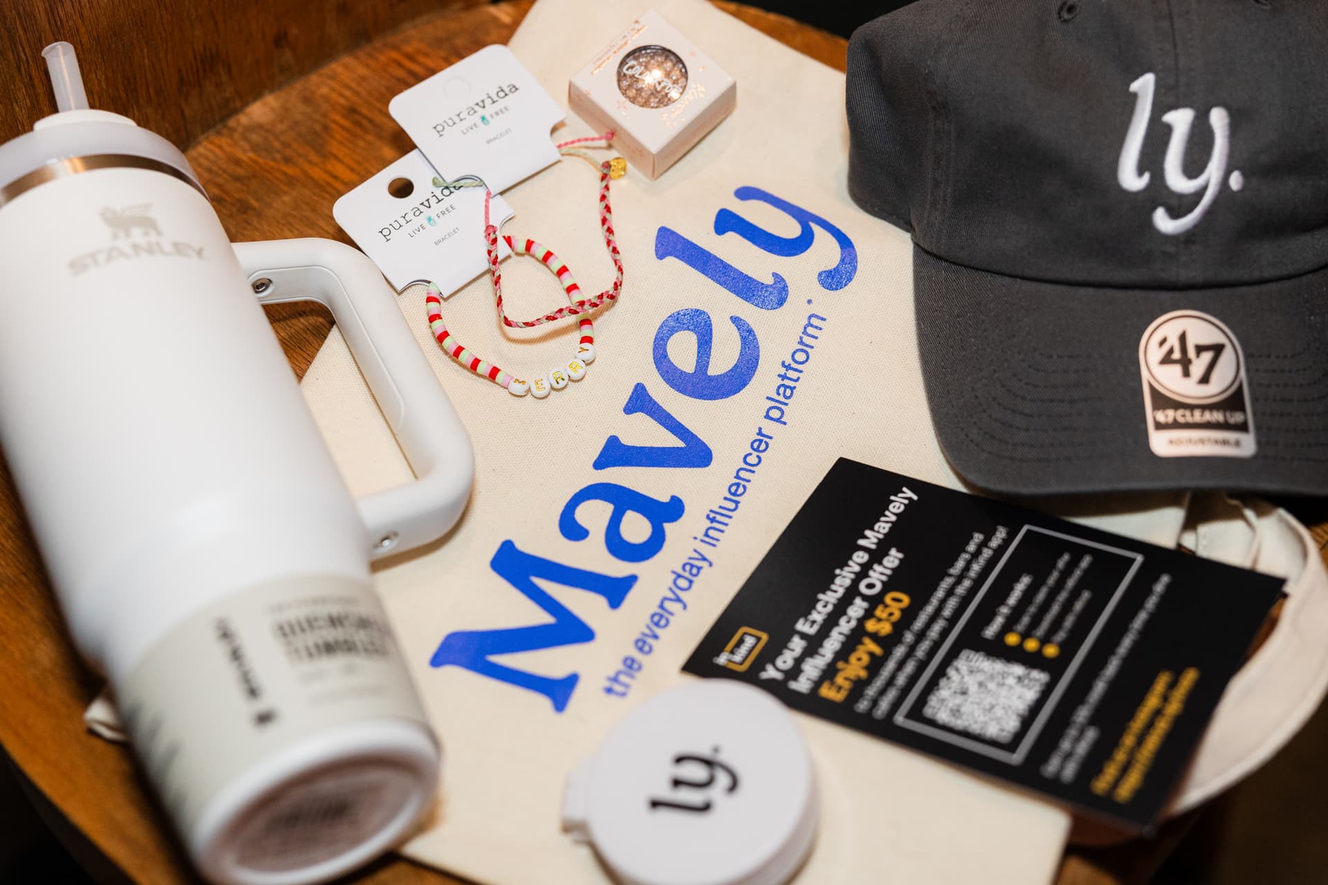 Close-up detail shot of branded event signage, name badges, and curated decor at a corporate event in Austin